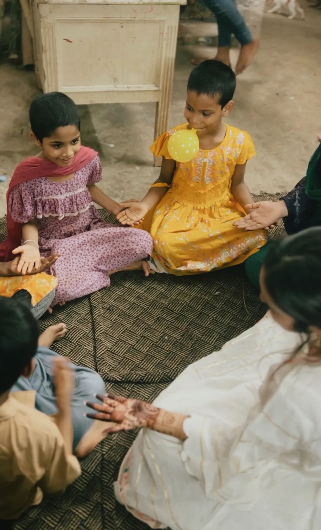 Orphan children receiving festive livestock
