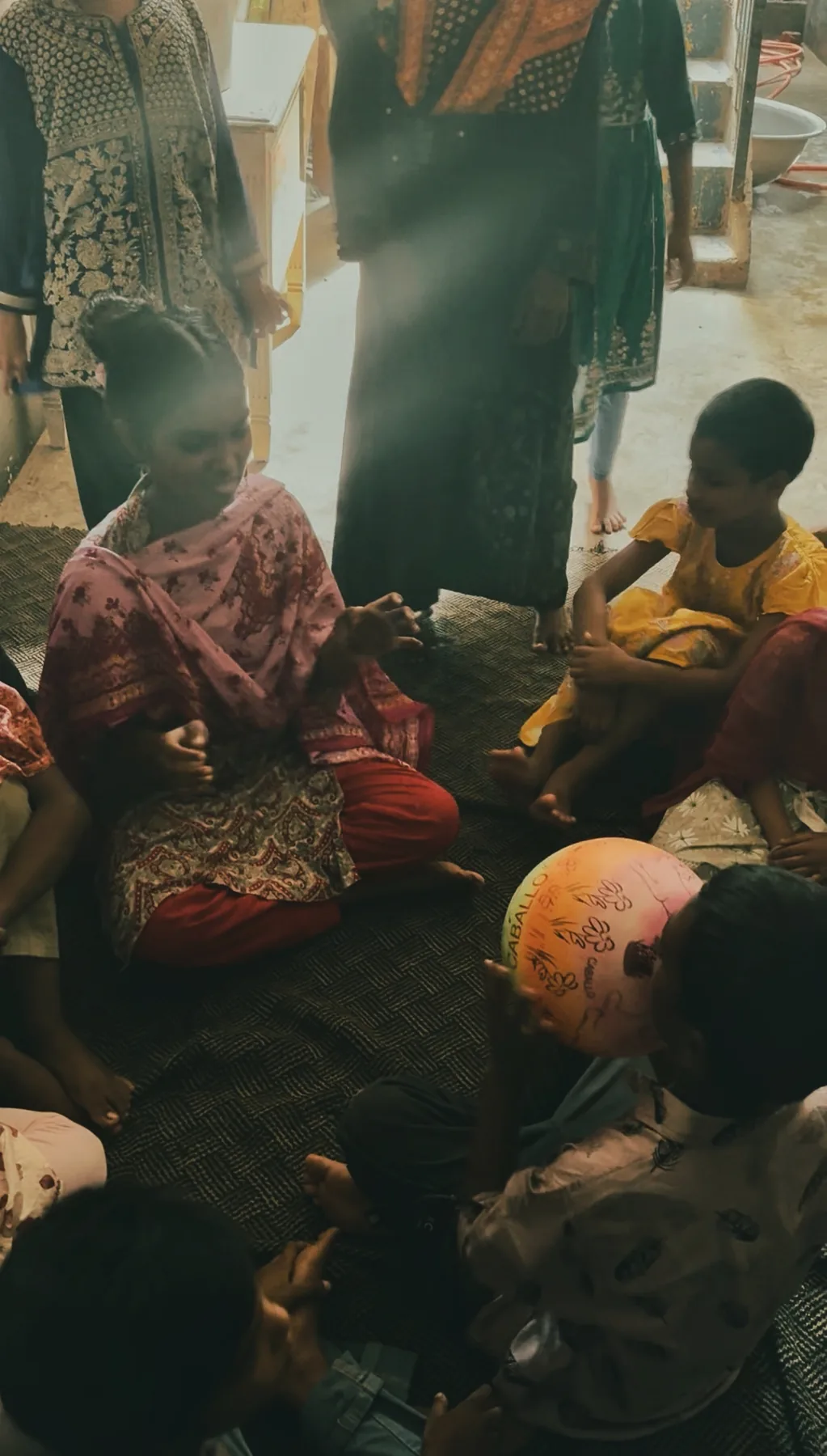 Youth volunteers interacting with children